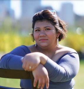 2019 ThreeSixty Scholar Heidi Sanchez Avila standing outside in a purple shirt.