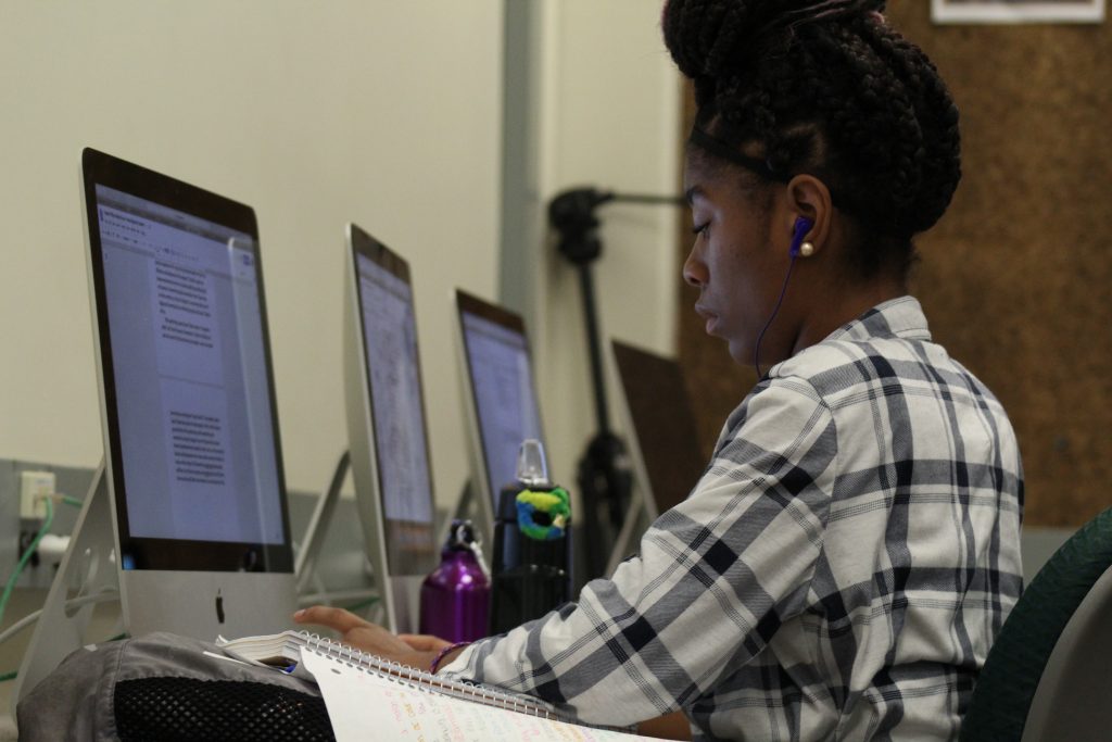 News Reporter Academy student Kaleah Phillips-Kelley Bynum hard at work on her article.
