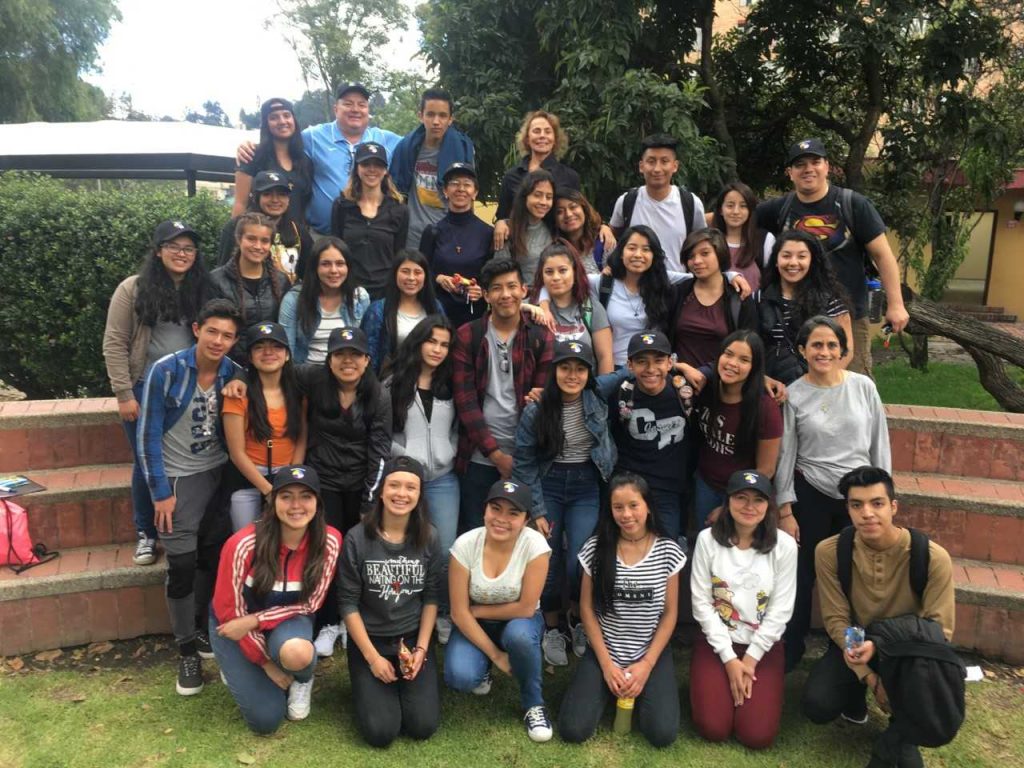 Grace Strangis (top row, fourth from left) and students who went on the Bogota trip pose for a picture after a visit to an orphanage. The group spent a week in Bogota building and painting homes for families. (Photo courtesy of Pathways to Children)