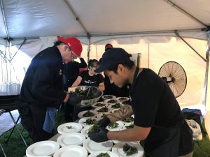 Frank Haney and staff prepare indigenous meal for catering event.