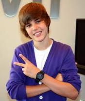 photo of Justin Bieber giving a peace sign with his left hand