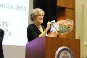 Lynda McDonnell receiving flowers at the annual ThreeSixty fall fundraiser 